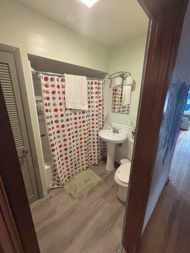 4304 N Oriole Ave, Norridge, IL 60706 - full bathroom featuring wood finished floors and shower / bath combo