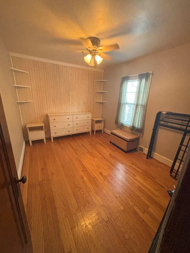 4304 N Oriole Ave, Norridge, IL 60706 - unfurnished bedroom featuring wood finished floors and ceiling fan