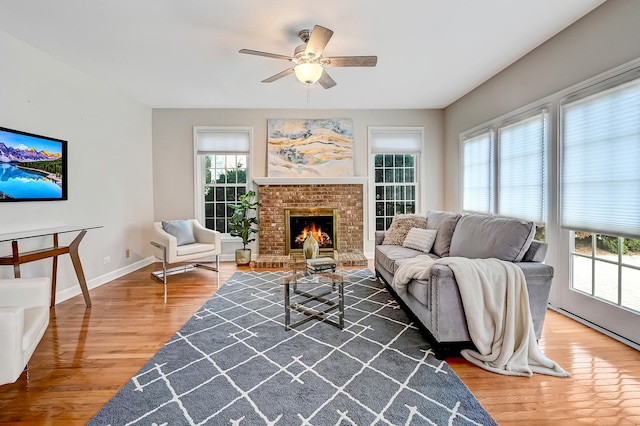 1501 Pine View Ct, Darien, IL 60561 - living room featuring wood finished floors, a ceiling fan, and a brick fireplace