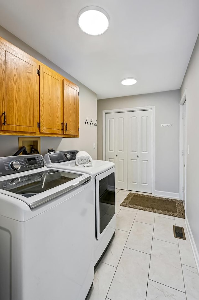 1501 Pine View Ct, Darien, IL 60561 - laundry area with cabinet space, separate washer and dryer, and light tile patterned flooring