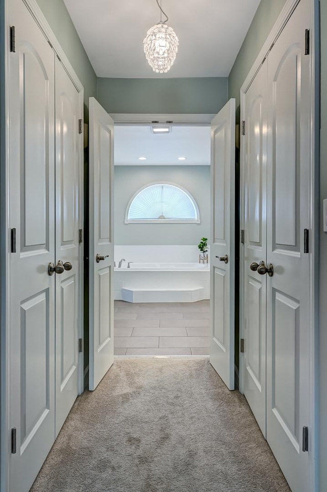 1501 Pine View Ct, Darien, IL 60561 - corridor featuring carpet and a chandelier