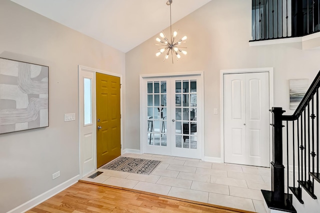 1501 Pine View Ct, Darien, IL 60561 - entrance foyer with stairway, high vaulted ceiling, a chandelier, french doors, and wood finished floors