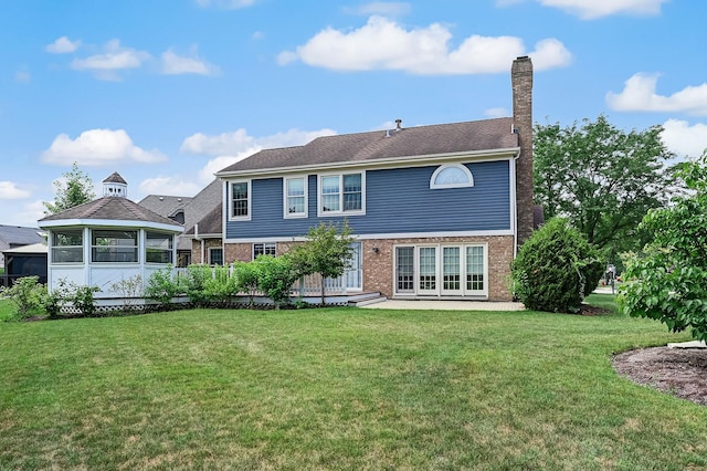 1501 Pine View Ct, Darien, IL 60561 - back of house featuring a chimney, a lawn, brick siding, and a patio