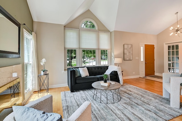 1501 Pine View Ct, Darien, IL 60561 - living area featuring wood finished floors, high vaulted ceiling, and a chandelier
