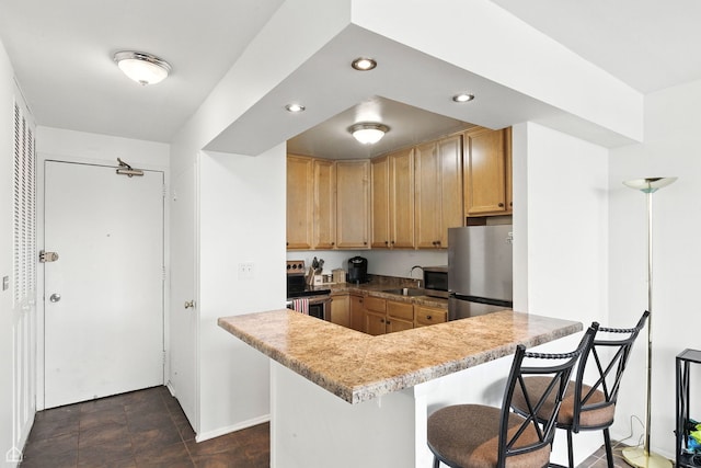 4250 N Marine Dr Unit 1912, Chicago, IL 60613 - kitchen with stainless steel appliances, a kitchen bar, recessed lighting, light brown cabinets, and light countertops