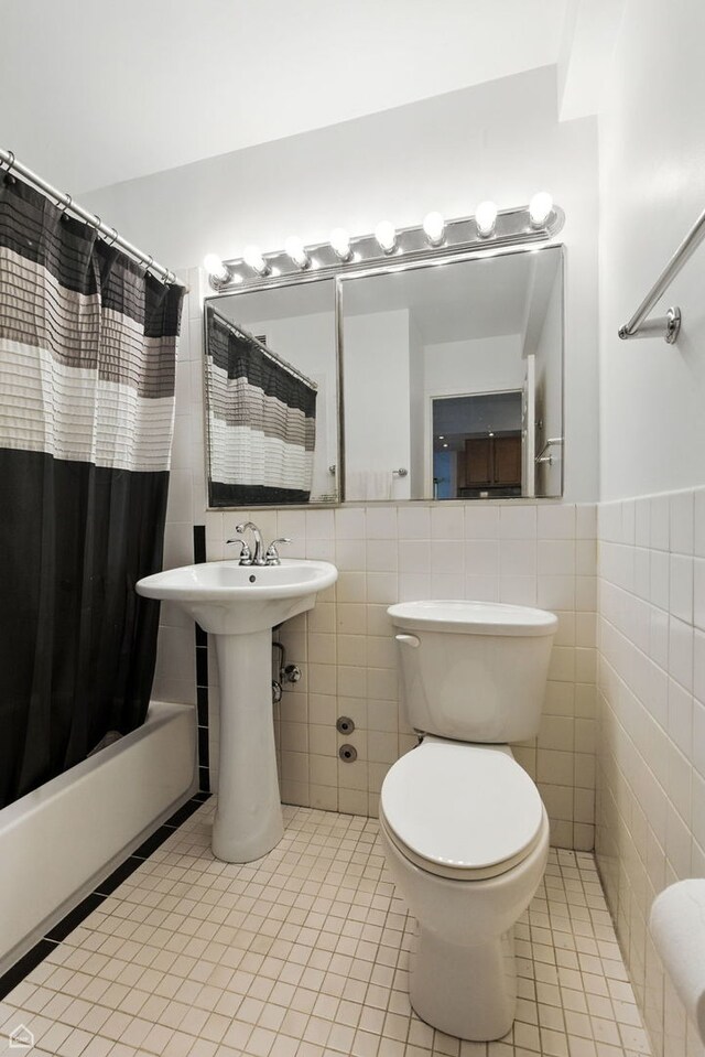 4250 N Marine Dr Unit 1912, Chicago, IL 60613 - full bathroom with tile walls, tile patterned floors, shower / tub combo, and a wainscoted wall