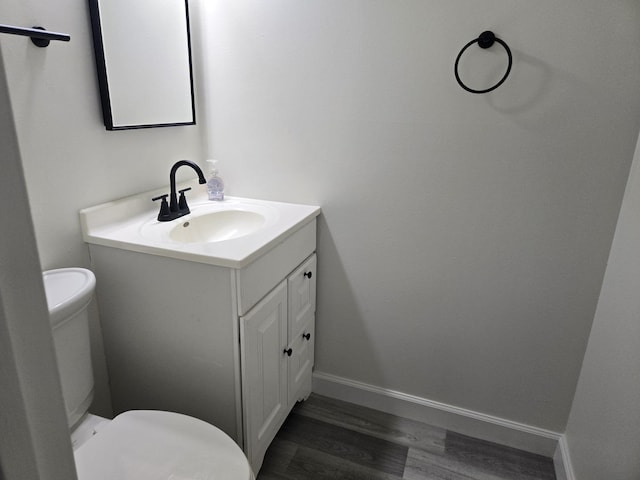 220 S Roselle Rd Unit 308, Schaumburg, IL 60193 - half bathroom with vanity and wood finished floors