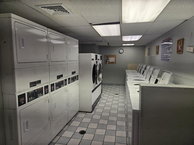 220 S Roselle Rd Unit 308, Schaumburg, IL 60193 - community laundry room featuring stacked washer / drying machine and light tile patterned floors