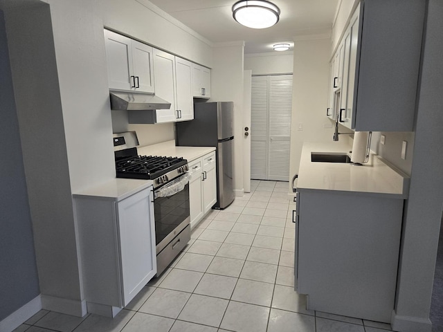 220 S Roselle Rd Unit 308, Schaumburg, IL 60193 - kitchen with appliances with stainless steel finishes, ornamental molding, under cabinet range hood, light countertops, and light tile patterned floors