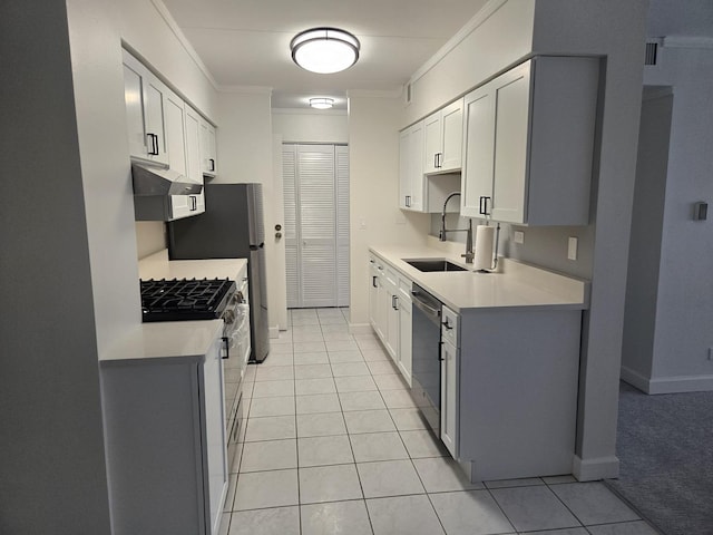 220 S Roselle Rd Unit 308, Schaumburg, IL 60193 - kitchen with appliances with stainless steel finishes, range hood, crown molding, light countertops, and light tile patterned flooring