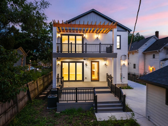 223 Center St, Naperville, IL 60540 - rear view of property with a balcony, board and batten siding, a fenced backyard, and a pergola