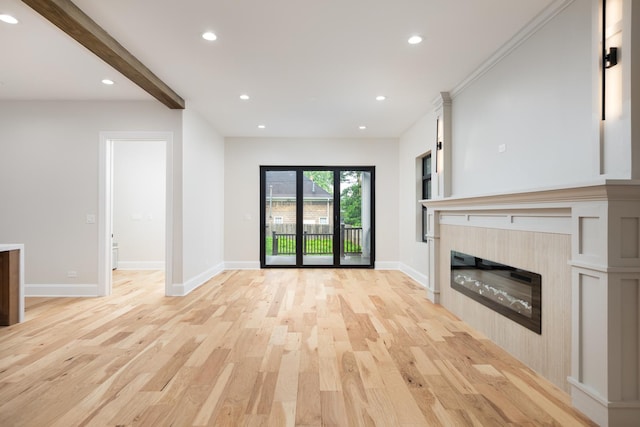 223 Center St, Naperville, IL 60540 - unfurnished living room with light wood-style flooring, a glass covered fireplace, recessed lighting, and beam ceiling