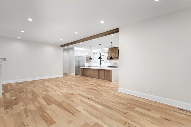 223 Center St, Naperville, IL 60540 - unfurnished living room featuring recessed lighting and light wood-style flooring
