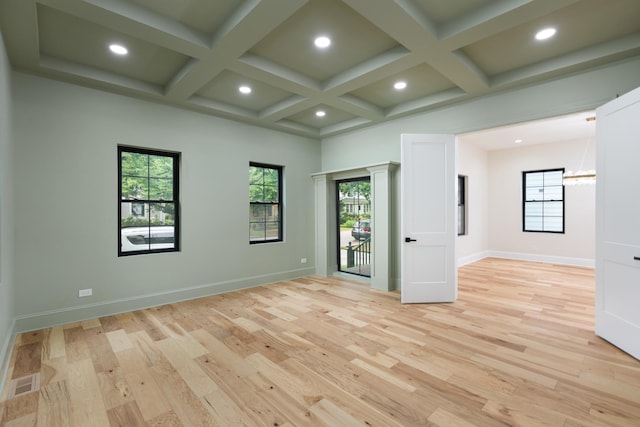 223 Center St, Naperville, IL 60540 - empty room featuring coffered ceiling, recessed lighting, healthy amount of natural light, a chandelier, and light wood finished floors