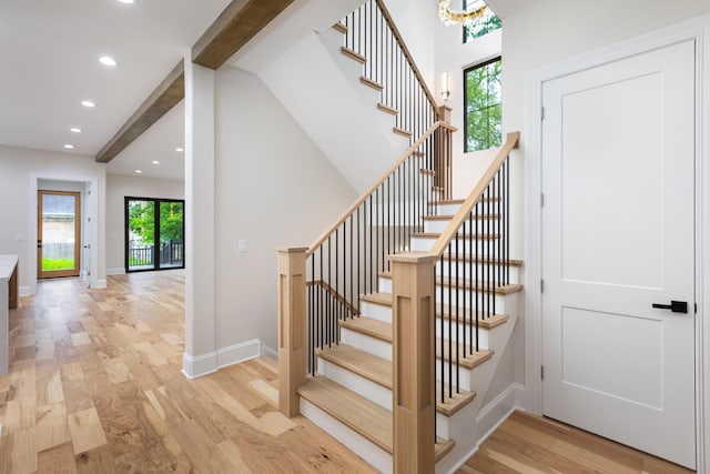 223 Center St, Naperville, IL 60540 - stairs with beamed ceiling, wood finished floors, recessed lighting, and a chandelier