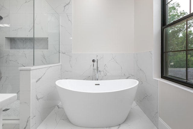 223 Center St, Naperville, IL 60540 - full bathroom featuring marble tiled flooring, tile walls, a freestanding bath, and a wainscoted wall