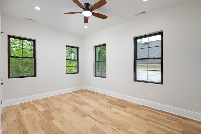 223 Center St, Naperville, IL 60540 - empty room with light wood finished floors, a ceiling fan, recessed lighting, and healthy amount of natural light