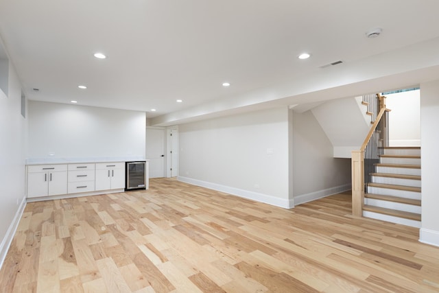 223 Center St, Naperville, IL 60540 - finished basement featuring wine cooler, a dry bar, light wood-style flooring, stairs, and recessed lighting