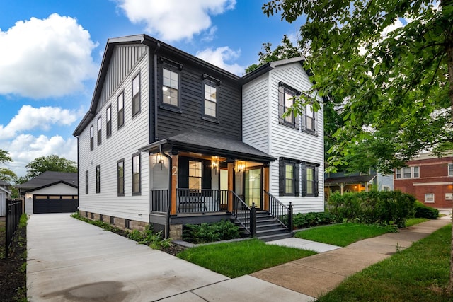 223 Center St, Naperville, IL 60540 - view of front of house featuring covered porch, an outdoor structure, and a detached garage