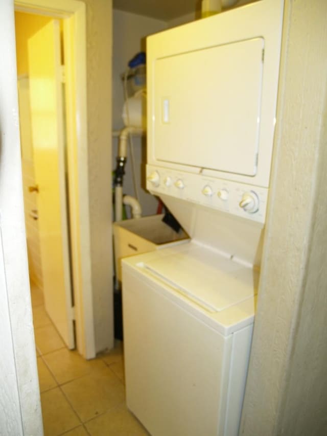 22340 Chappel Ave, Sauk Village, IL 60411 - washroom with stacked washer / drying machine and light tile patterned flooring