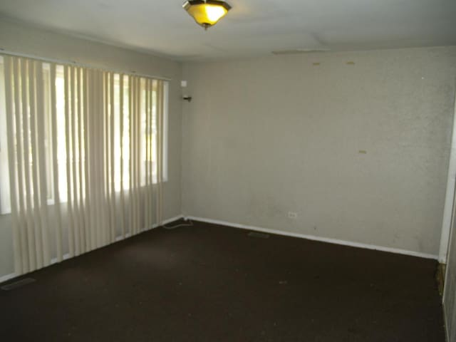 22340 Chappel Ave, Sauk Village, IL 60411 - spare room with baseboards and dark colored carpet