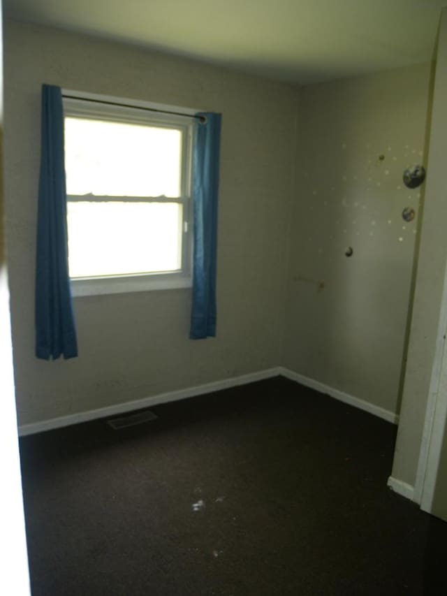 22340 Chappel Ave, Sauk Village, IL 60411 - spare room with baseboards and dark carpet