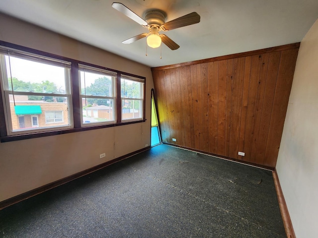 9201 S Kedzie Ave Unit 3, Evergreen Park, IL 60805 - empty room with ceiling fan and wood walls