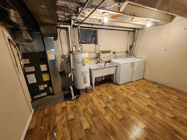 9201 S Kedzie Ave Unit 3, Evergreen Park, IL 60805 - unfinished basement featuring electric water heater, washing machine and clothes dryer, and wood finished floors