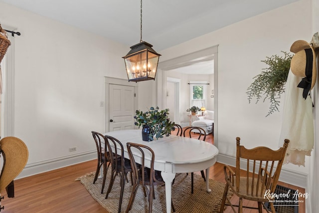217 N Maple St, Momence, IL 60954 - dining space with a chandelier and light wood finished floors