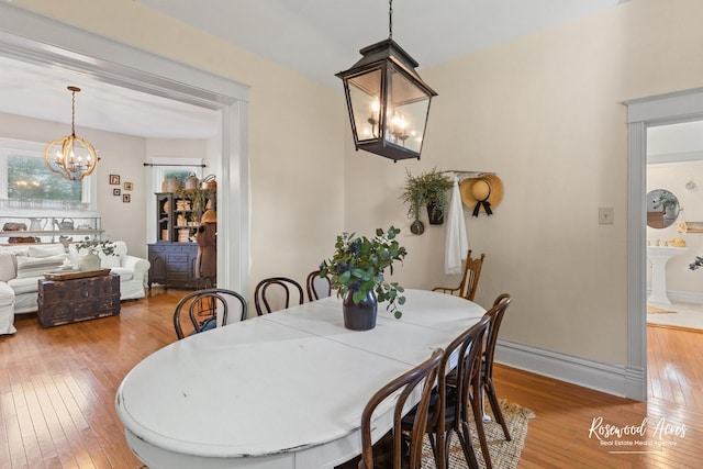 217 N Maple St, Momence, IL 60954 - dining space with a chandelier and light wood-type flooring