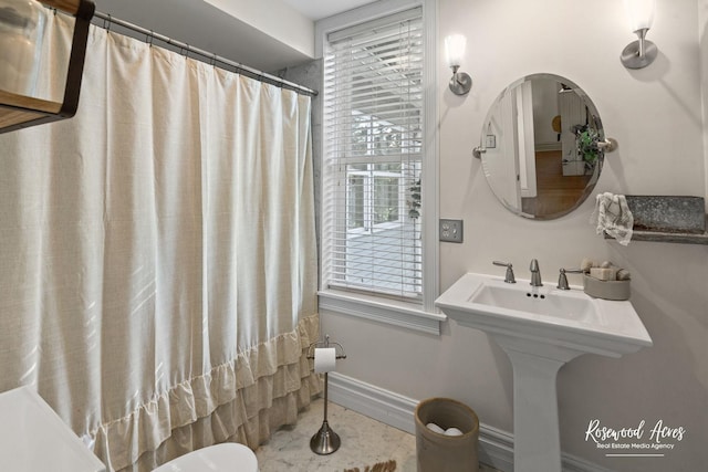 217 N Maple St, Momence, IL 60954 - full bathroom featuring shower / bathtub combination with curtain and baseboards
