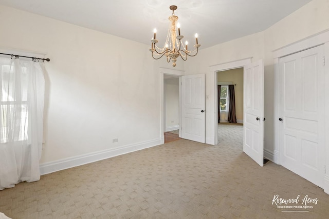 217 N Maple St, Momence, IL 60954 - unfurnished dining area featuring a chandelier and light carpet
