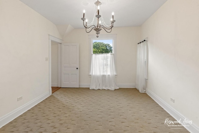 217 N Maple St, Momence, IL 60954 - empty room with a chandelier and light colored carpet