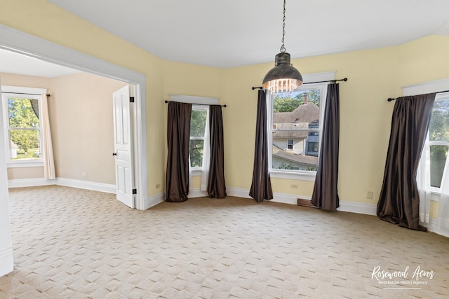 217 N Maple St, Momence, IL 60954 - carpeted empty room with healthy amount of natural light