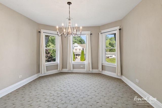 217 N Maple St, Momence, IL 60954 - empty room featuring a chandelier and light carpet