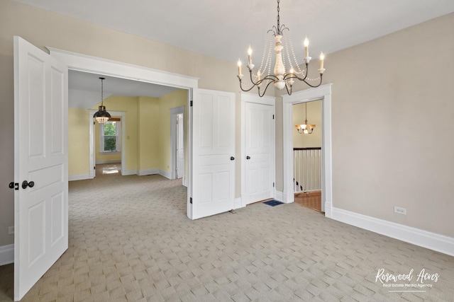 217 N Maple St, Momence, IL 60954 - spare room featuring a chandelier and carpet flooring