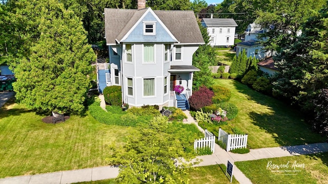217 N Maple St, Momence, IL 60954 - victorian house with a chimney and a shingled roof