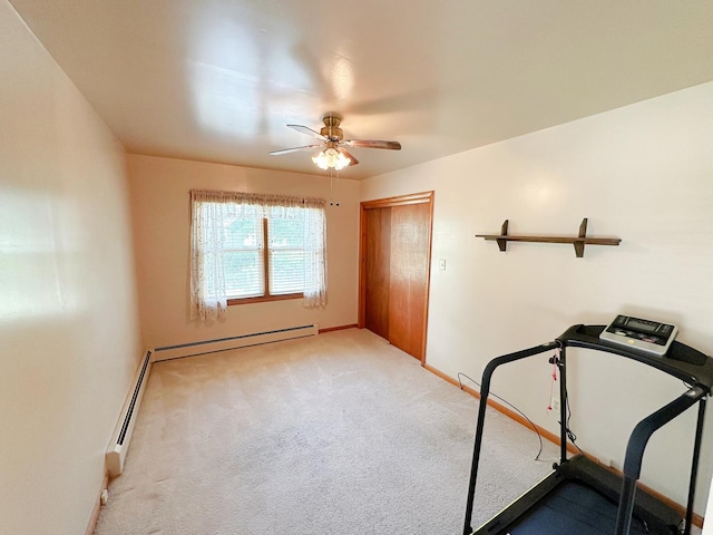 919 S Vermillion St, Streator, IL 61364 - workout area with a baseboard heating unit, ceiling fan, and carpet