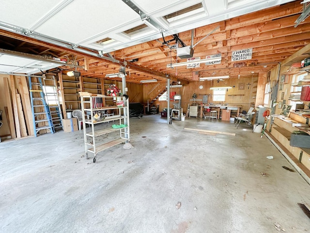 919 S Vermillion St, Streator, IL 61364 - garage with a garage door opener and a workshop area