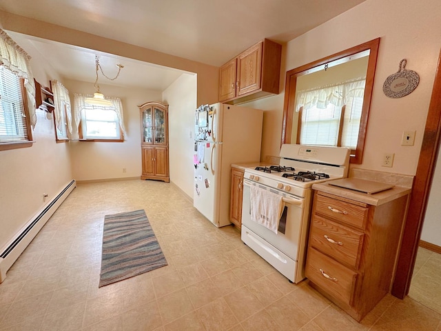 919 S Vermillion St, Streator, IL 61364 - kitchen with white appliances, a baseboard heating unit, light countertops, brown cabinets, and pendant lighting