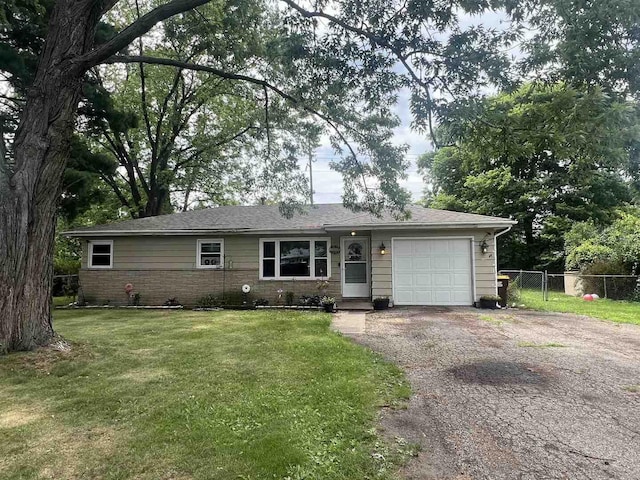 8212 Cameo Dr, Machesney Park, IL 61115 - single story home with driveway, an attached garage, and brick siding