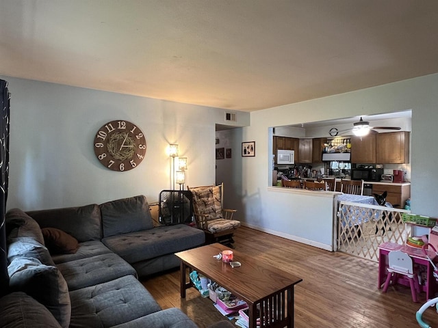 8212 Cameo Dr, Machesney Park, IL 61115 - living area with wood finished floors and a ceiling fan