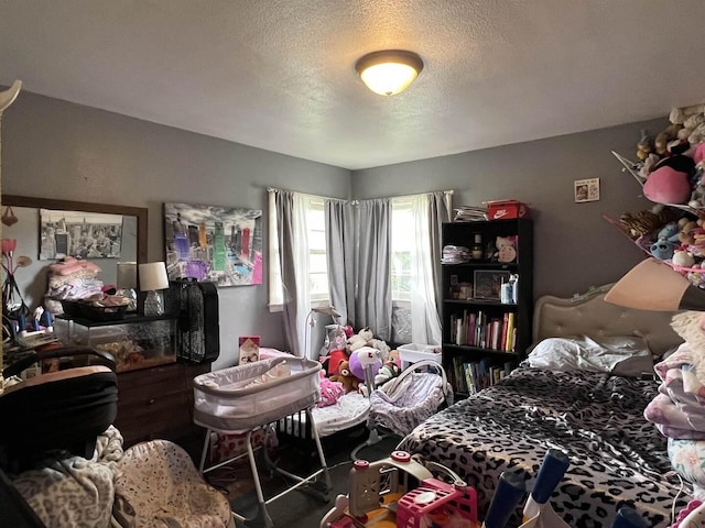 8212 Cameo Dr, Machesney Park, IL 61115 - bedroom featuring a textured ceiling