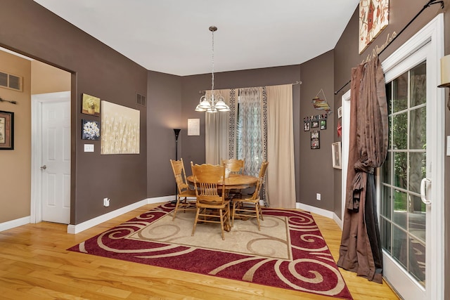 300 Village Ln, Seneca, IL 61360 - dining area featuring a chandelier and wood finished floors