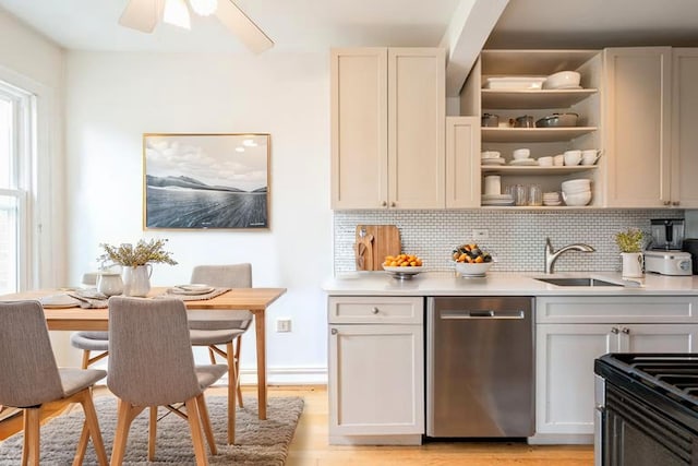 4240 N Clarendon Ave Unit 301S, Chicago, IL 60613 - kitchen featuring stainless steel dishwasher, backsplash, light countertops, and light wood-type flooring