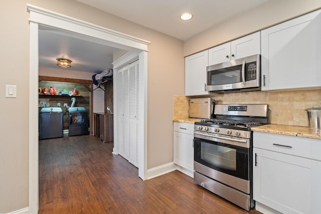 16000 Long Ave, Oak Forest, IL 60452 - kitchen with appliances with stainless steel finishes, washing machine and clothes dryer, dark wood-style flooring, white cabinetry, and light stone countertops