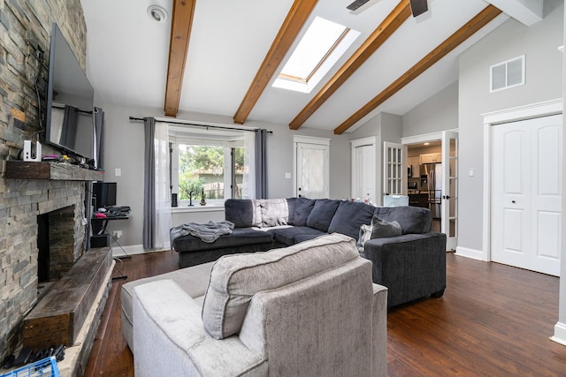 16000 Long Ave, Oak Forest, IL 60452 - living area featuring dark wood-style floors, beamed ceiling, a large fireplace, a skylight, and high vaulted ceiling