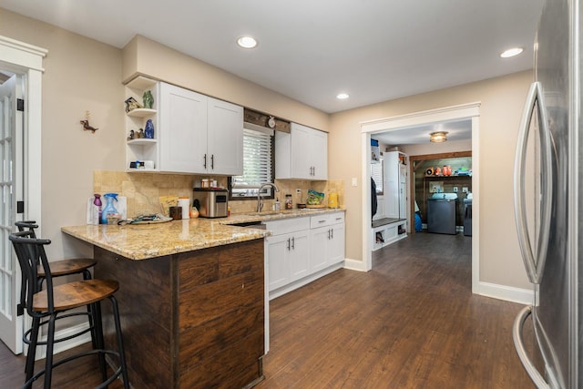 16000 Long Ave, Oak Forest, IL 60452 - kitchen featuring freestanding refrigerator, a peninsula, dark wood-style floors, white cabinets, and recessed lighting