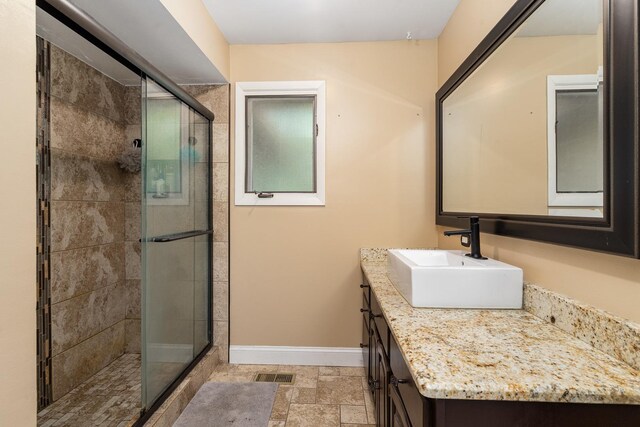 16000 Long Ave, Oak Forest, IL 60452 - full bathroom featuring vanity, a stall shower, and stone finish flooring