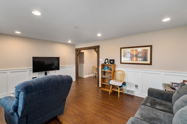 16000 Long Ave, Oak Forest, IL 60452 - living room featuring dark wood-style flooring, wainscoting, a decorative wall, and recessed lighting